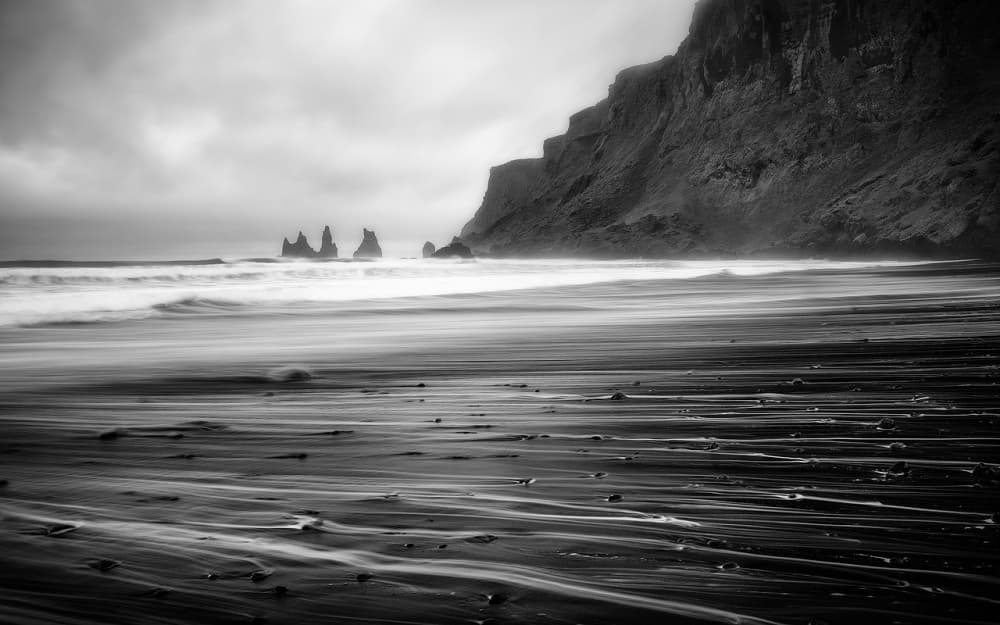 Black Beach Sea Stacks by Tomaz Klemensak — canvas wall art