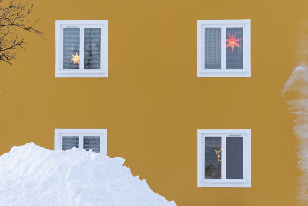 Snowy Yellow House Stars by Carlo Tonti — canvas wall art