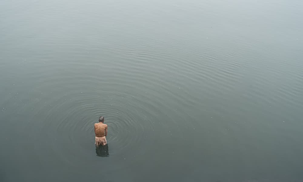 Man in Calm Water by Elior Segev — canvas wall art