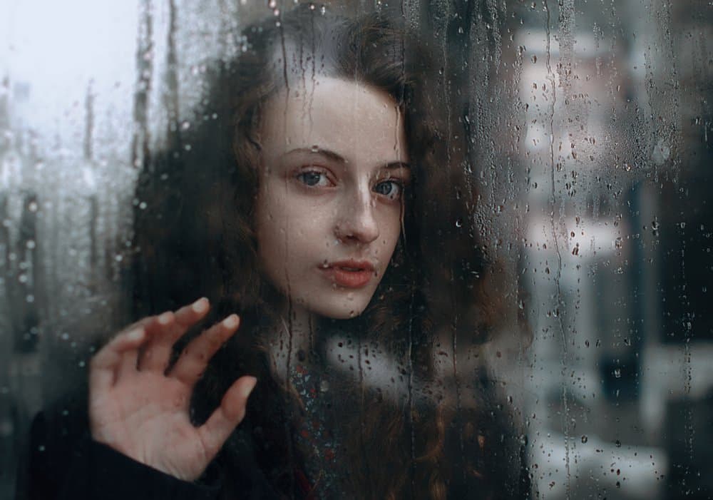 Woman by Rainy Window by Irina Bunyatyan — canvas wall art