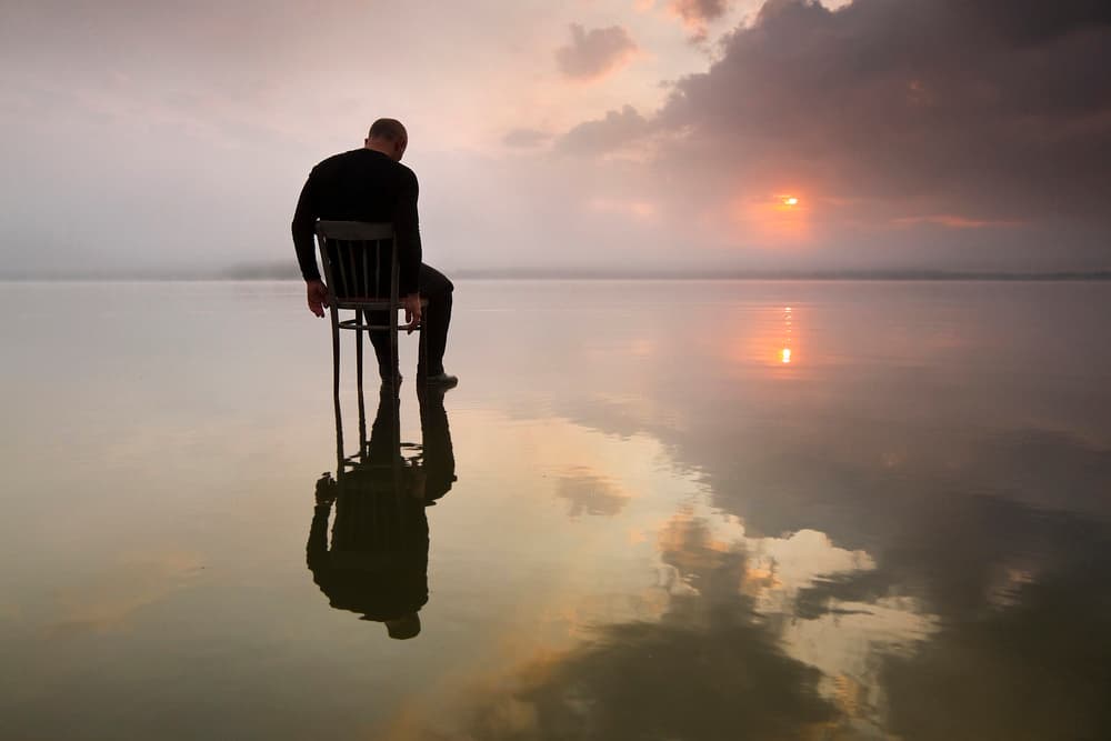 Man Sitting Sunset by Leszek Paradowski — canvas wall art
