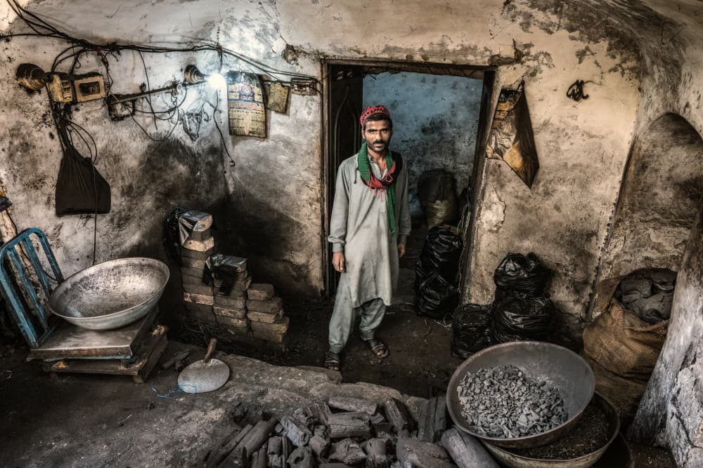 Charcoal Worker's Gaze by Trevor Cole — canvas wall art