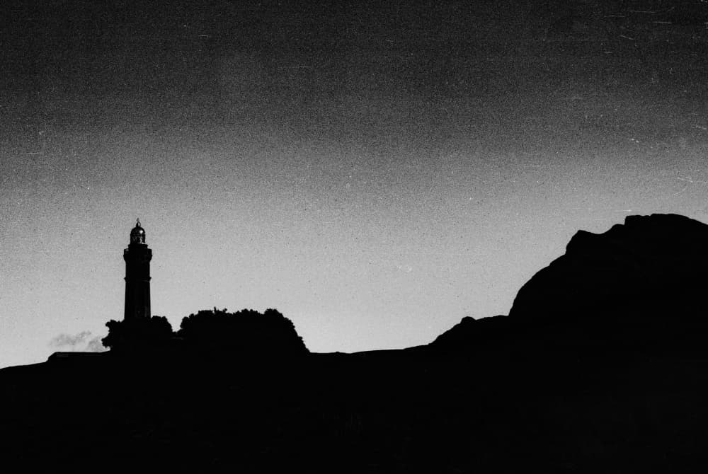 Coastal Lighthouse Silhouette by Paulo Abrantes — canvas wall art