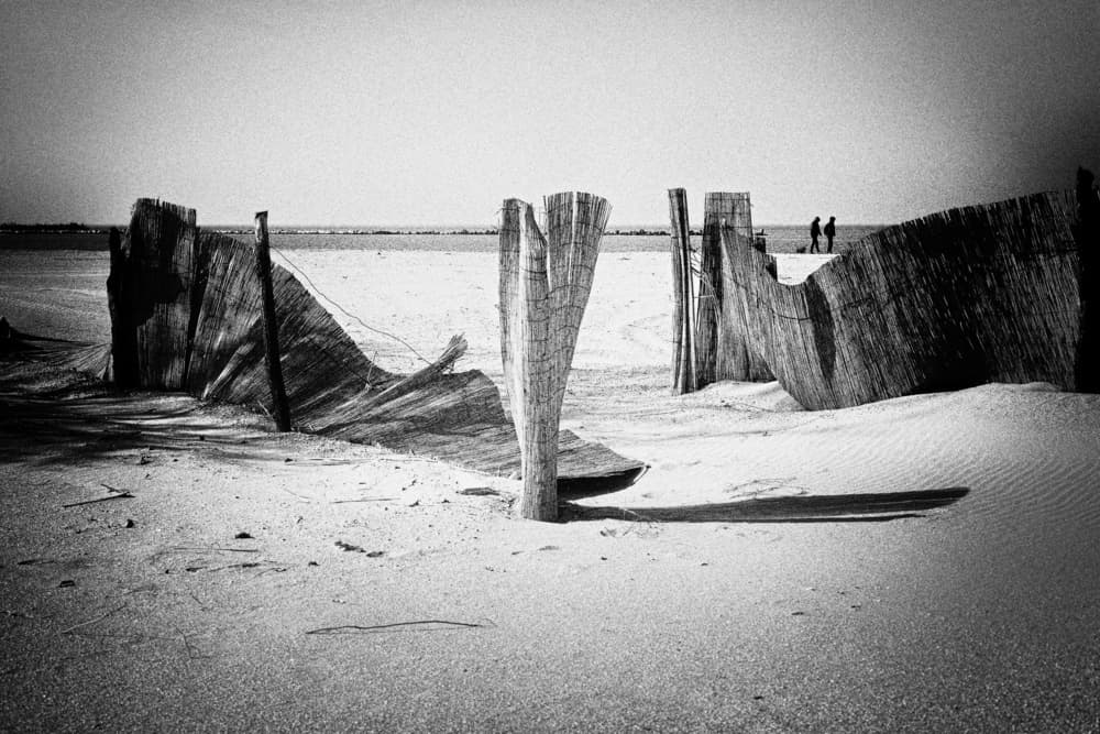 Dune Fences Distant Figures by Elena Raceala — canvas wall art