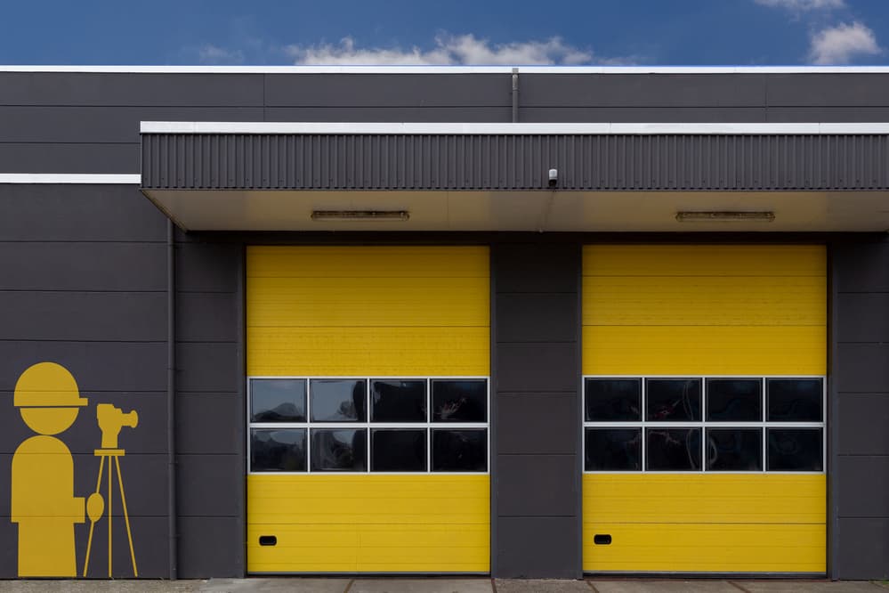 Bright Yellow Garage Doors by Theo Luycx — canvas wall art