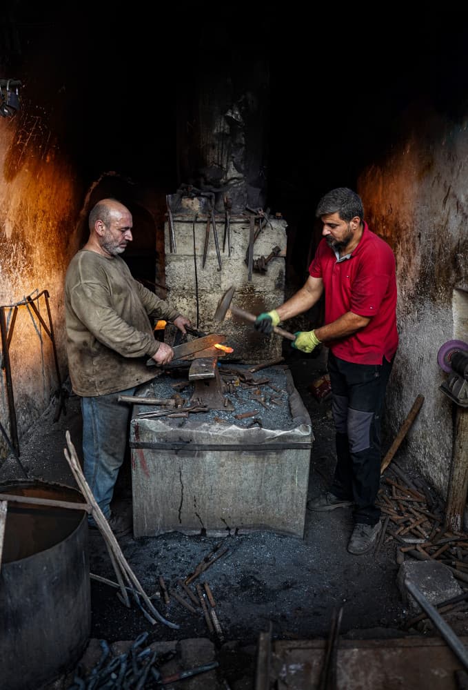 Blacksmiths at Work by Bashar Alsofey — canvas wall art