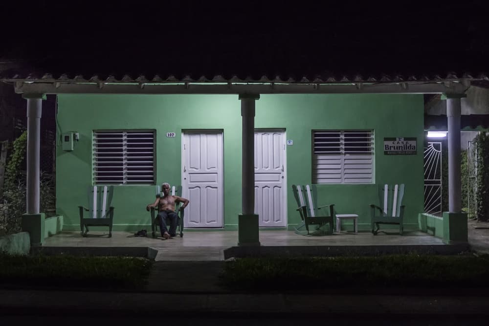 Man on Green Porch by Pavol Stranak — canvas wall art