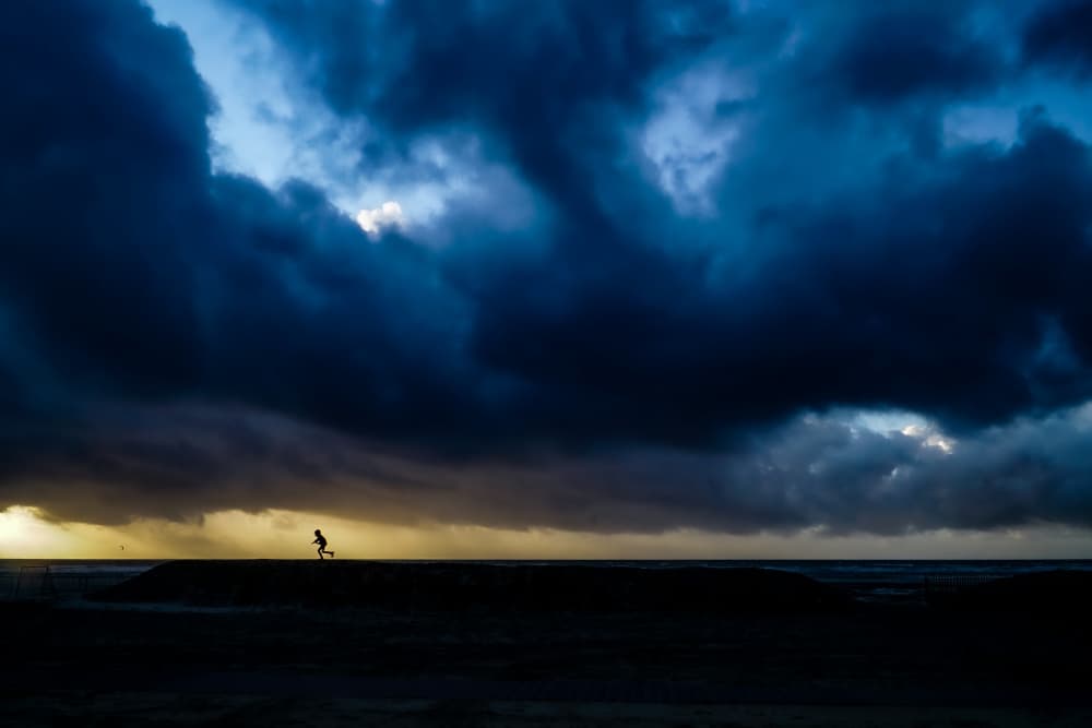 Running Under Storm Clouds by Stephane Navailles — canvas wall art