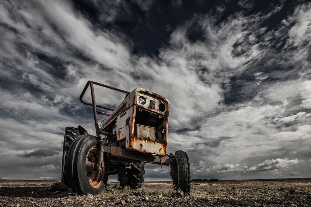 Rustic Tractor Dramatic Sky by Bragi Ingibergsson - BRIN — canvas wall art