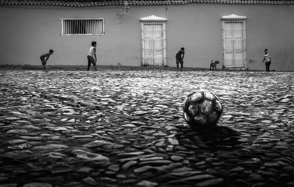 Boys Playing Street Soccer by Jean-Luc BESSON — canvas wall art