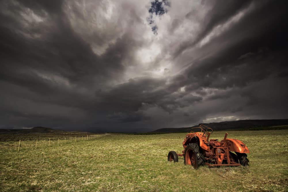 Rusty Tractor Storm Sky by Þorsteinn H. Ingibergsson — canvas wall art