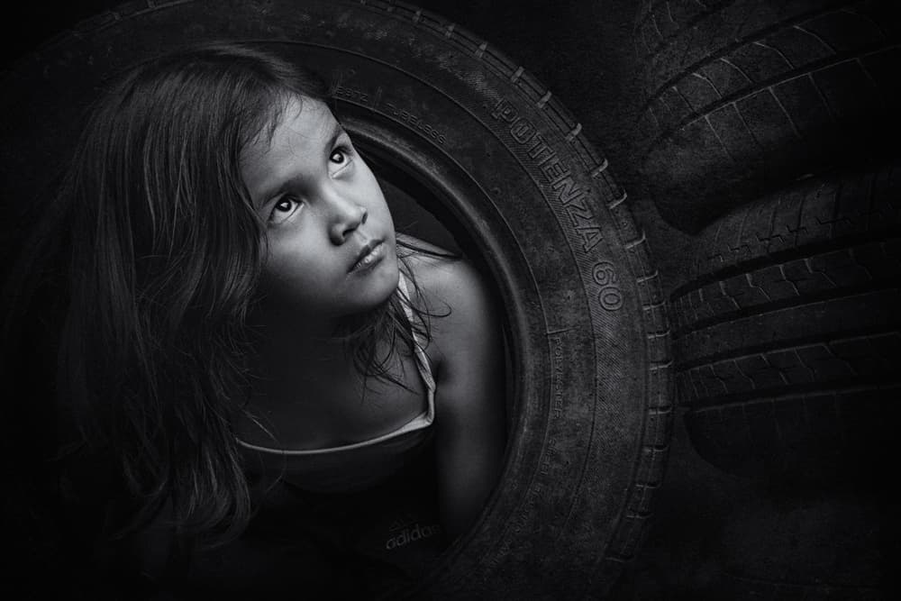 Pensive Girl In Tire by Arief Siswandhono — canvas wall art