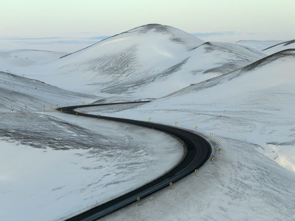 Winding Snowy Mountain Road by Jure Kravanja — canvas wall art