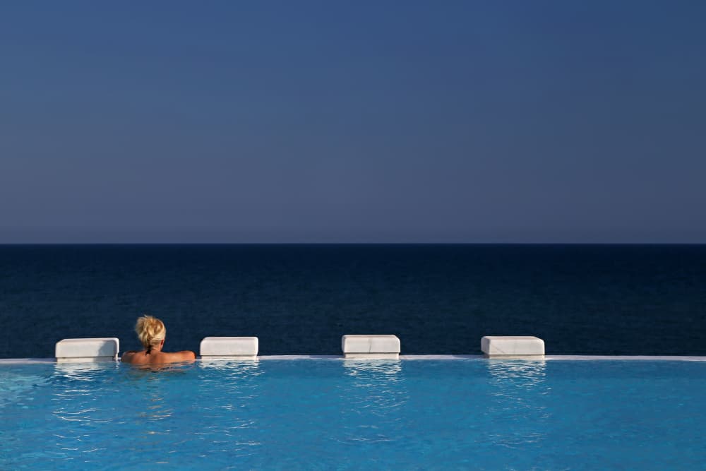 Woman In Infinity Pool by Ralitsa Byalkova — canvas wall art