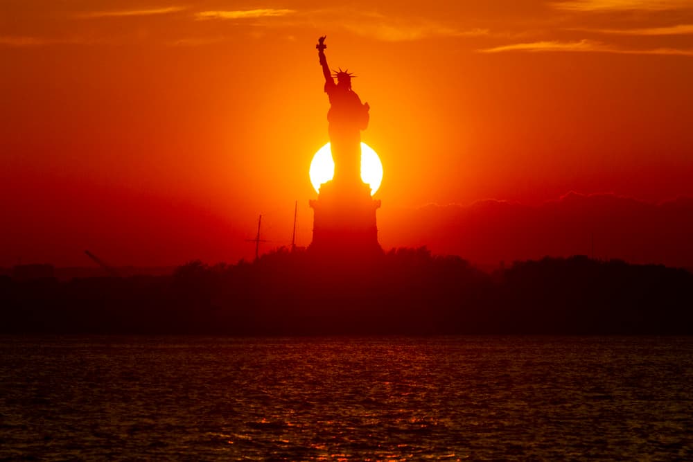 Sunset Over Lady Liberty by Michael Castellano — canvas wall art