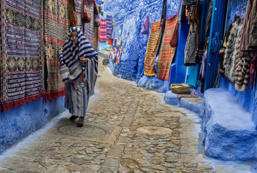 Blue City Woman by Andrei Nicolas - The Traveler — canvas wall art