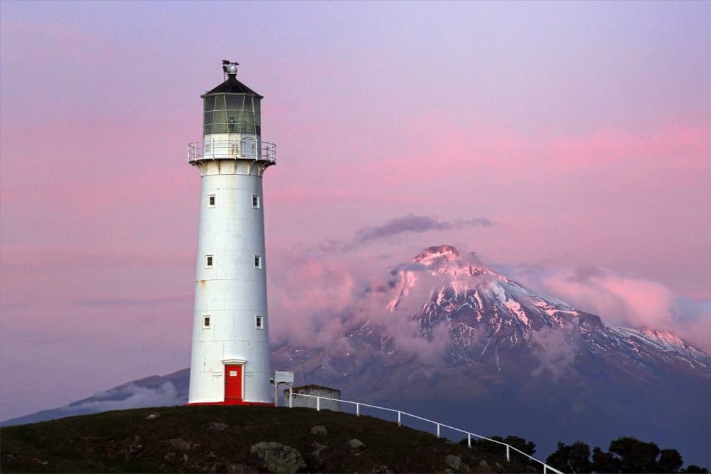 Pink Sky Lighthouse Mountain by Dragan Keca — canvas wall art