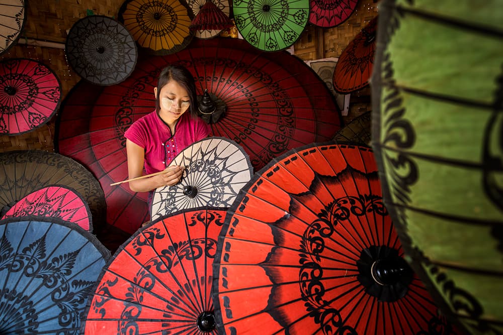 Artisan Painting Umbrellas by Gunarto Song — canvas wall art