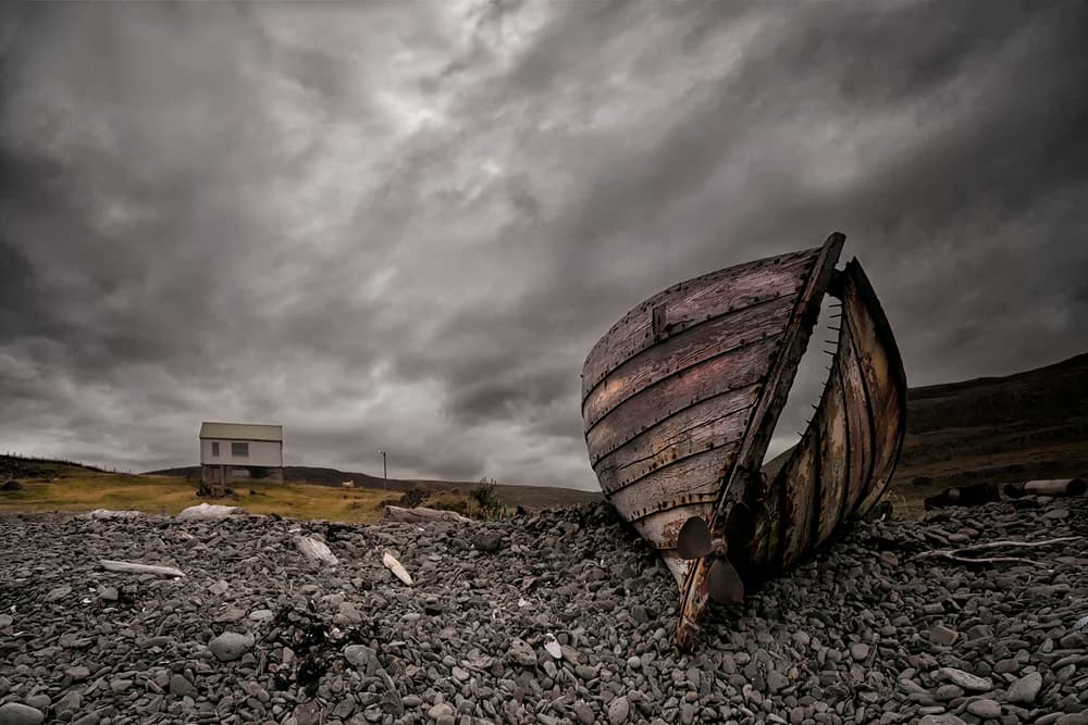 Stormy Coast Abandoned Boat by Þorsteinn H. Ingibergsson — canvas wall art