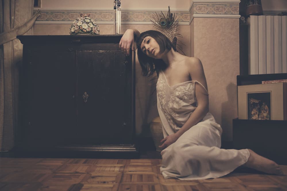Pensive Woman Indoors by Antonella Renzulli — canvas wall art