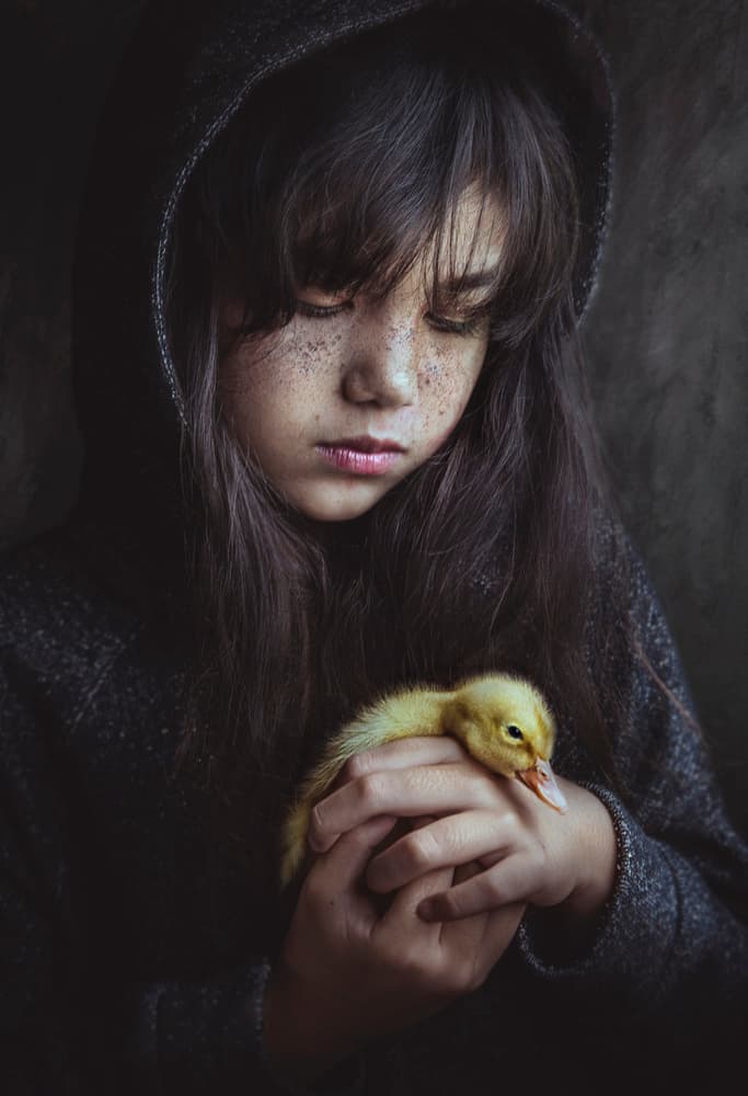 Girl Holding Duckling by Sebastian Kisworo — canvas wall art