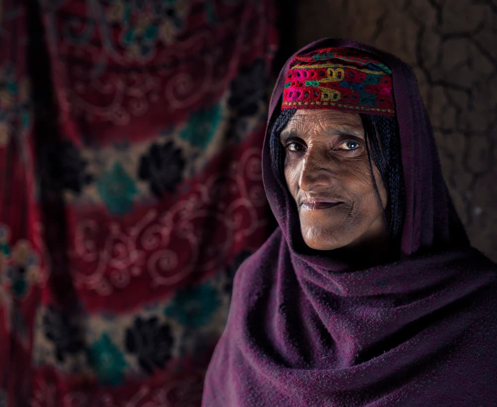 Elder Woman's Soulful Gaze by Haitham AL Farsi — canvas wall art