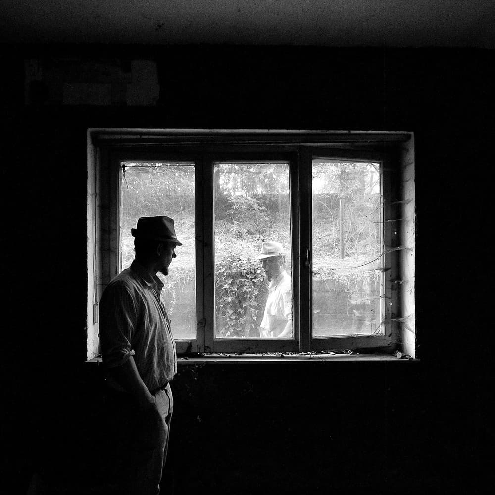 Men By The Window by Carlo Ferrara — canvas wall art