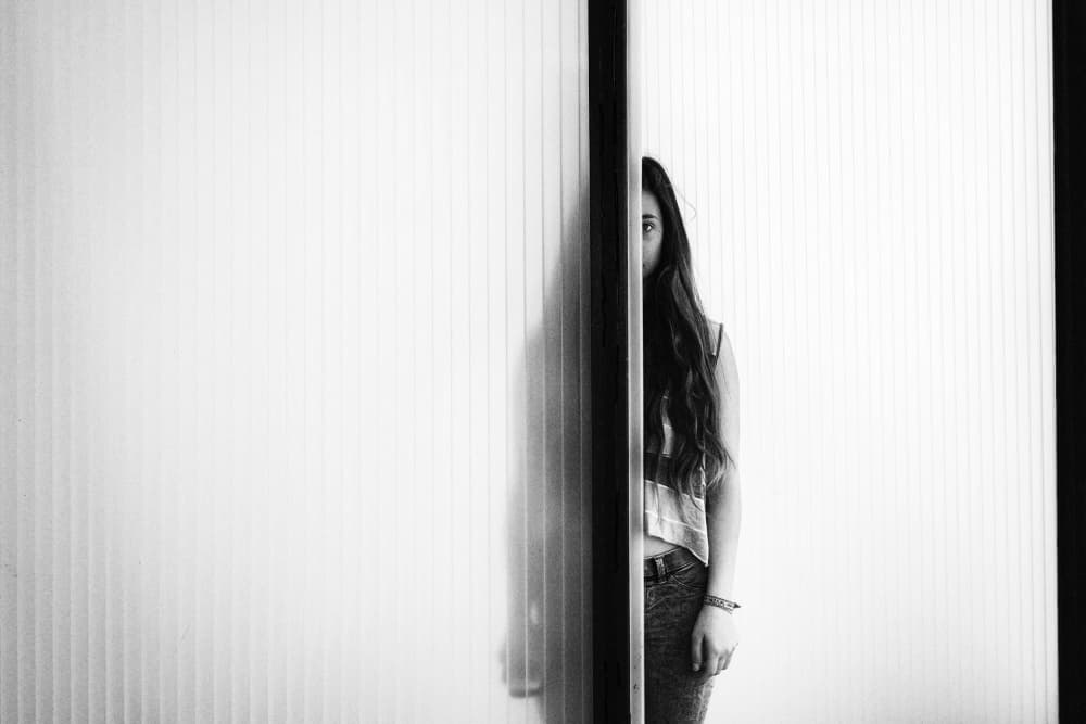 Young Woman Peeking by Laura Mexia — canvas wall art