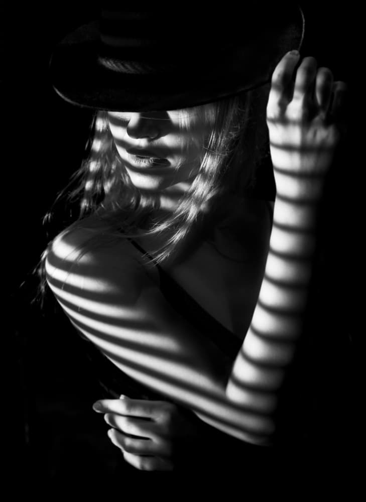 Shadowed Woman in Hat by Sebastian Kisworo — canvas wall art