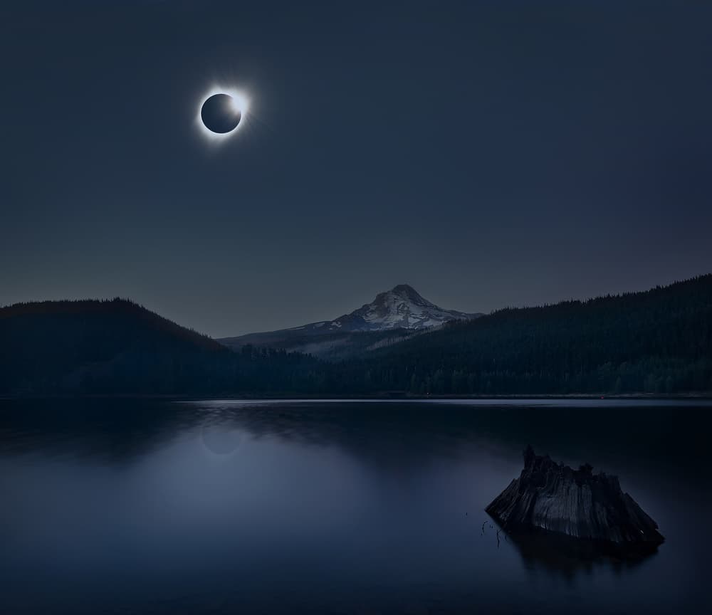 Eclipse Over Mountain Lake by Annie Poreider — canvas wall art
