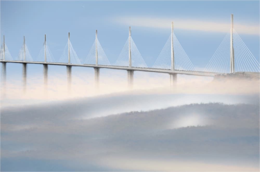 Modern Bridge Above Fog by Anna Cseresnjes — canvas wall art