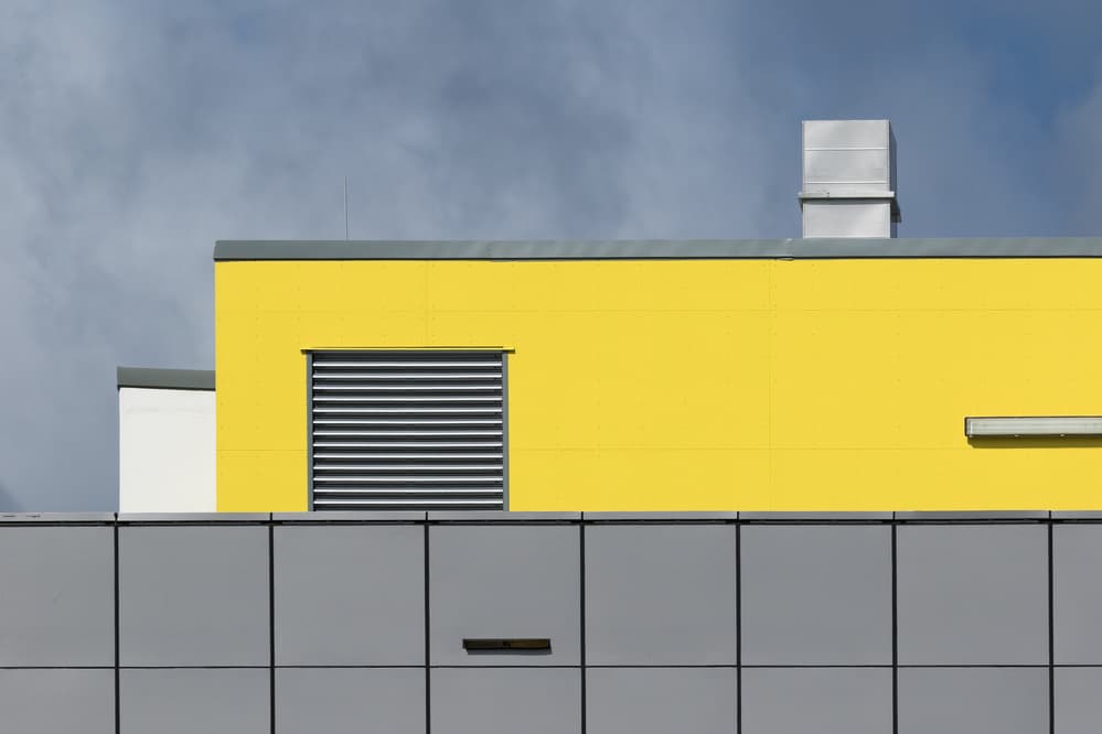 Geometric Yellow Building by Jacqueline Hammer — canvas wall art