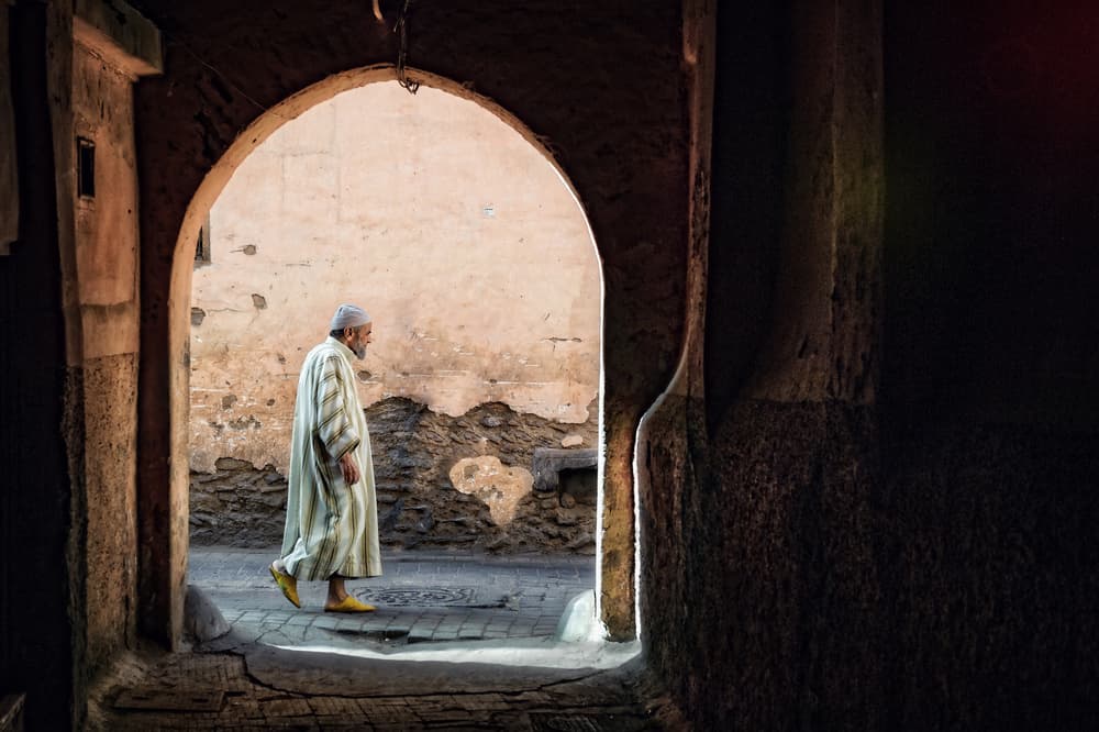 Moroccan Man in Archway by Piet Flour — canvas wall art