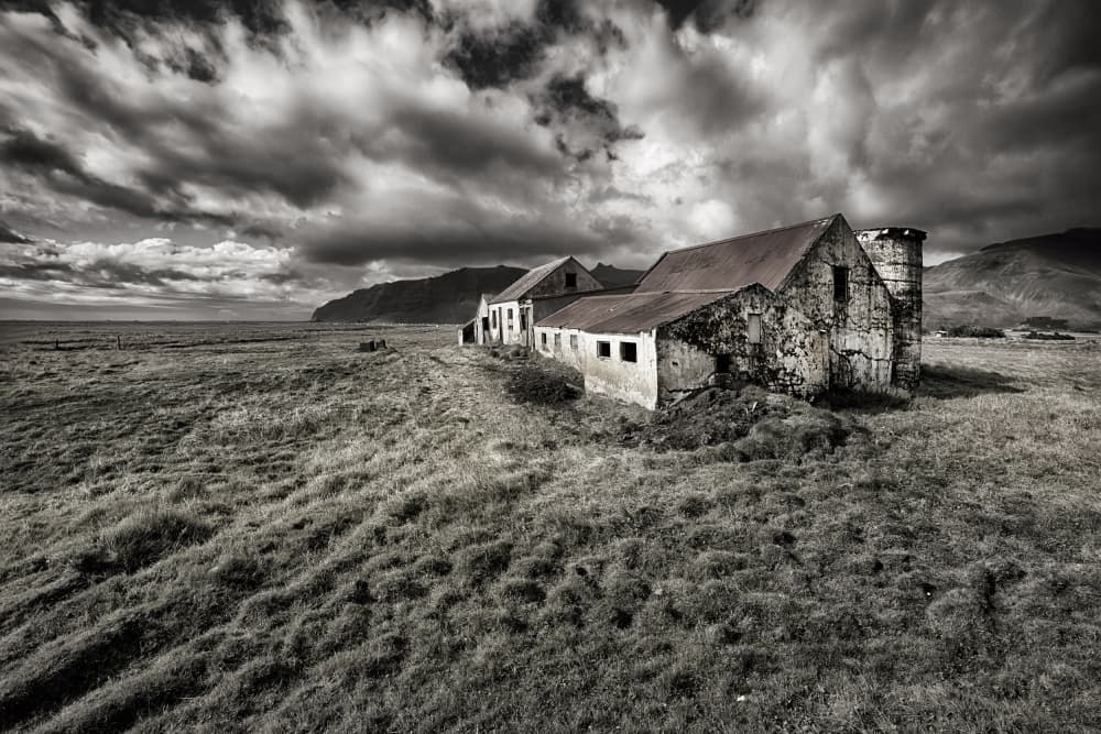 Abandoned Farm Under Stormy Sky by Þorsteinn H. Ingibergsson — canvas wall art