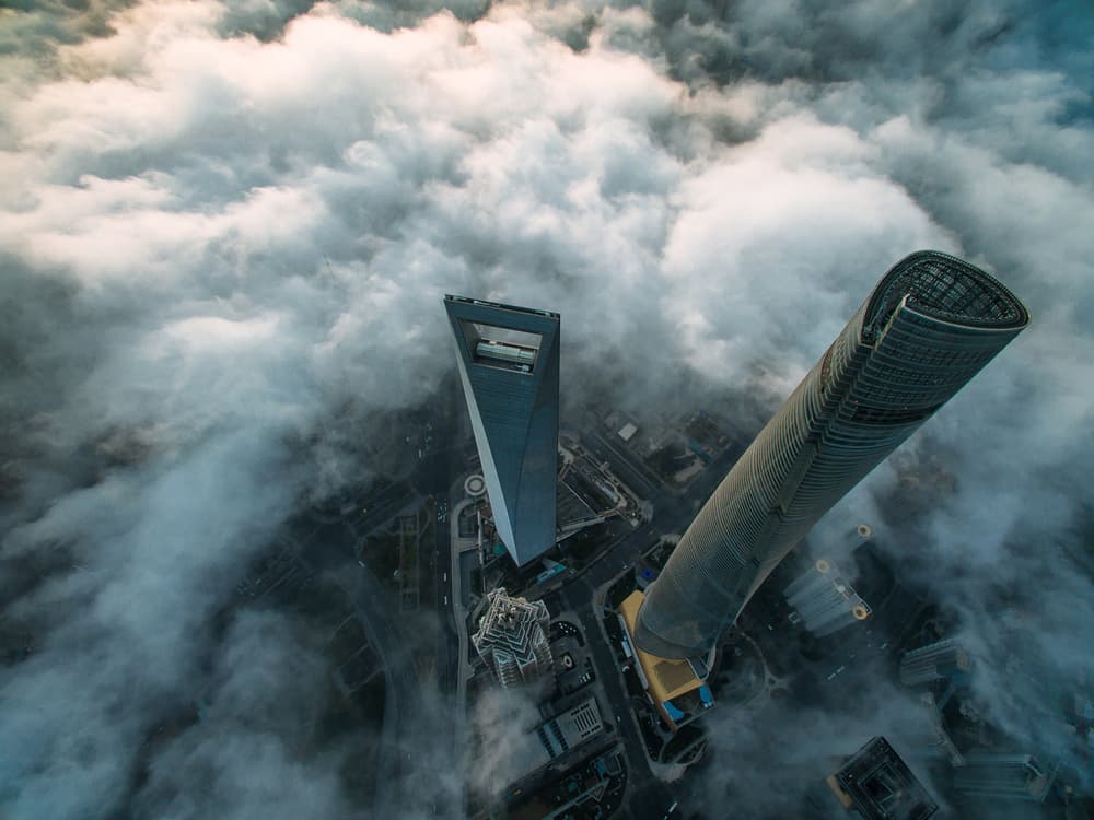 Skyscrapers Above Clouds by Stan Huang — canvas wall art