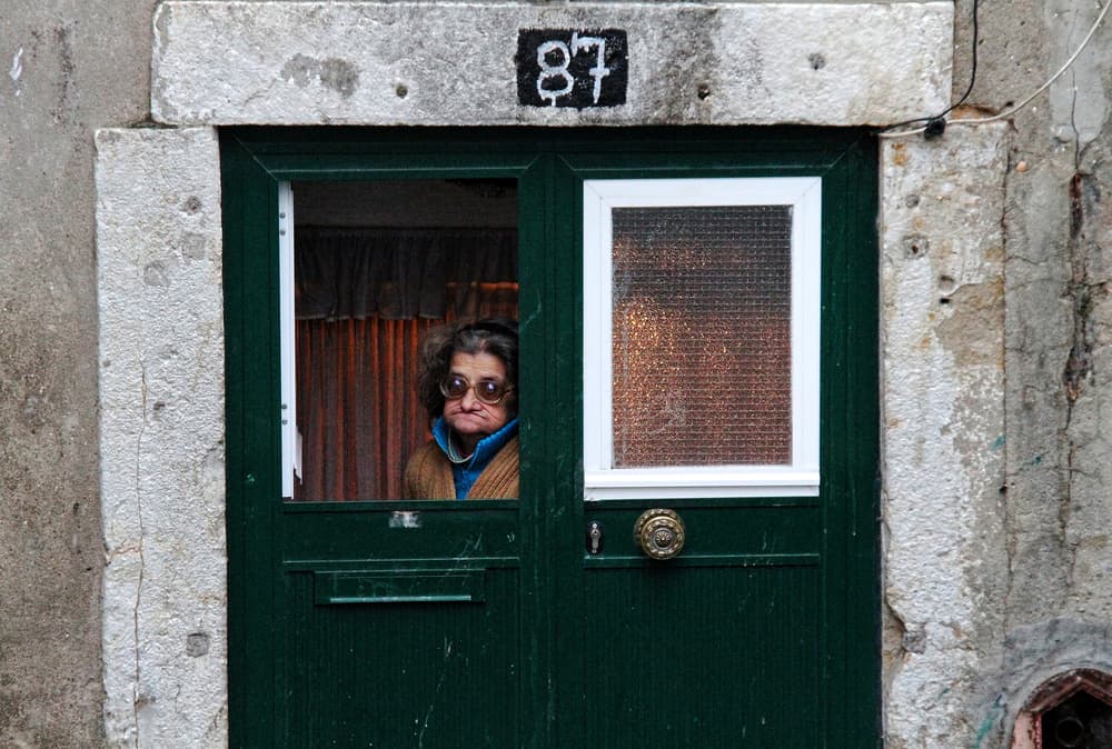 Curious Woman in Doorway by Fernando Alves — canvas wall art