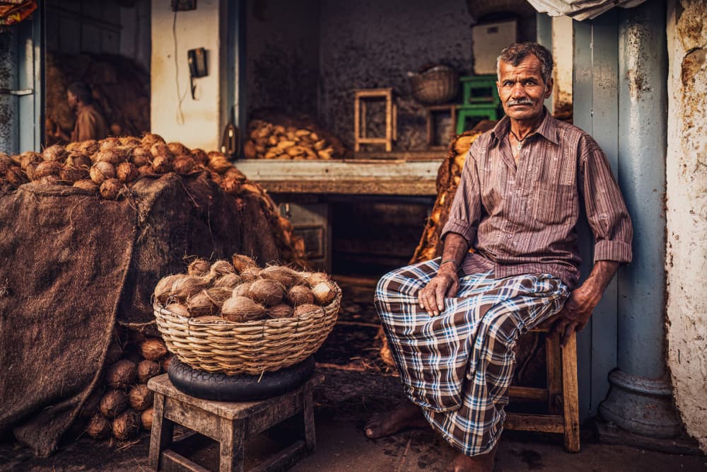 Indian Market Vendor by Marco Tagliarino — canvas wall art