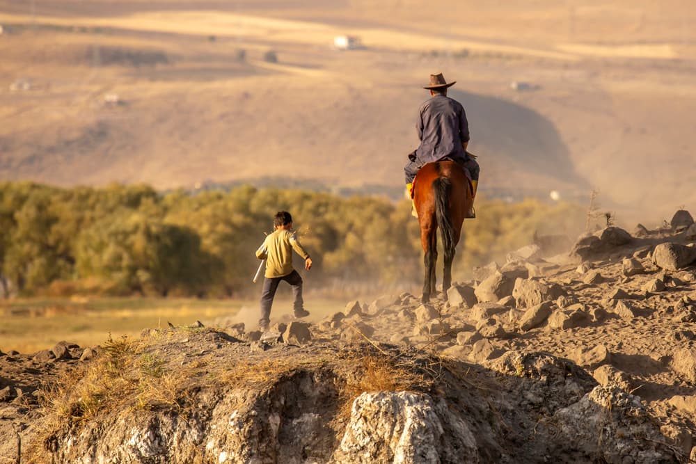 Boy Following Horseman by Zühdü Bilgin — canvas wall art