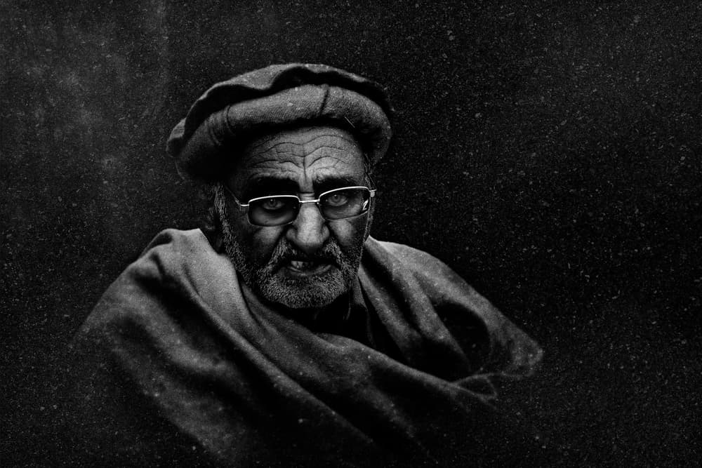 Elderly Man's Deep Gaze by FATHI ALDARWISH — canvas wall art