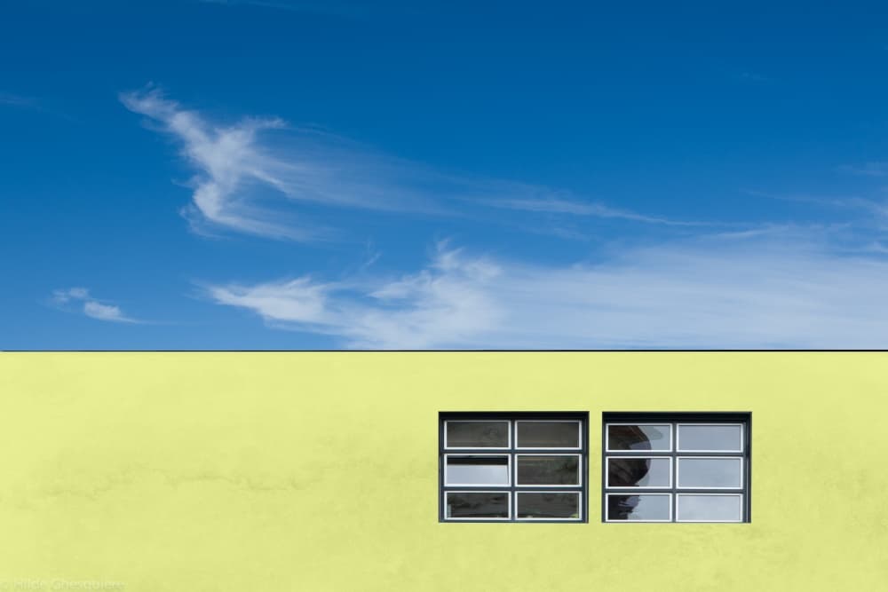 Blue Sky Yellow Wall by Hilde Ghesquiere — canvas wall art