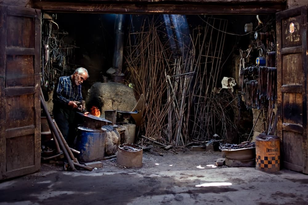 Blacksmith In Glowing Forge by Mohammadreza Momeni — canvas wall art