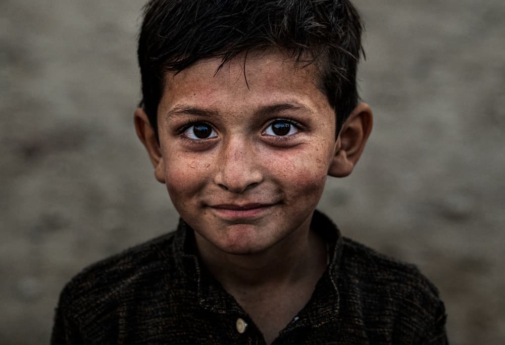 Innocent Boy Smiling by Joxe Inazio Kuesta Garmendia — canvas wall art