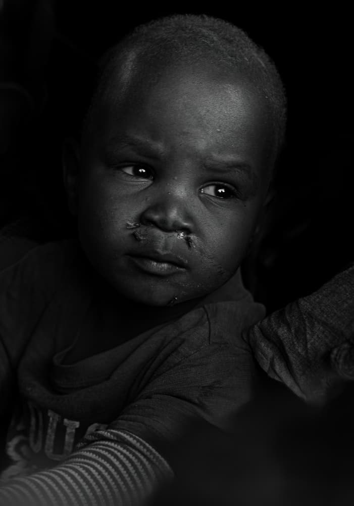 Thoughtful Young Boy by Johnson Huang — canvas wall art