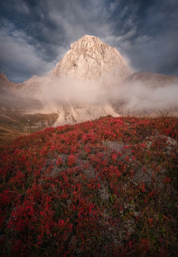 Red Slopes Mountain Fog by Ales Krivec — canvas wall art