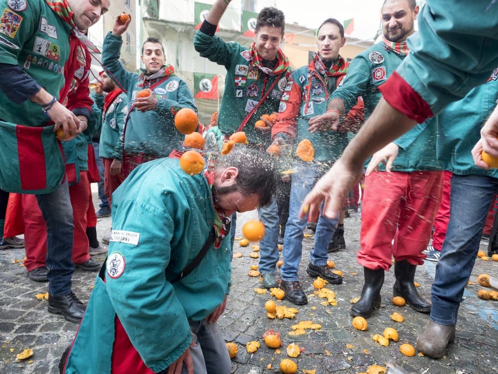 Orange Throwing Festival by Rino Terravecchia — canvas wall art