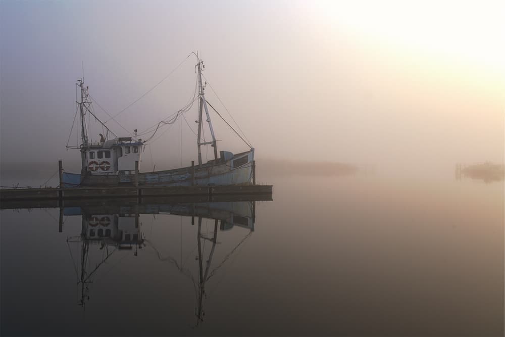 Misty Morning Boat Reflection by Leif Løndal — canvas wall art