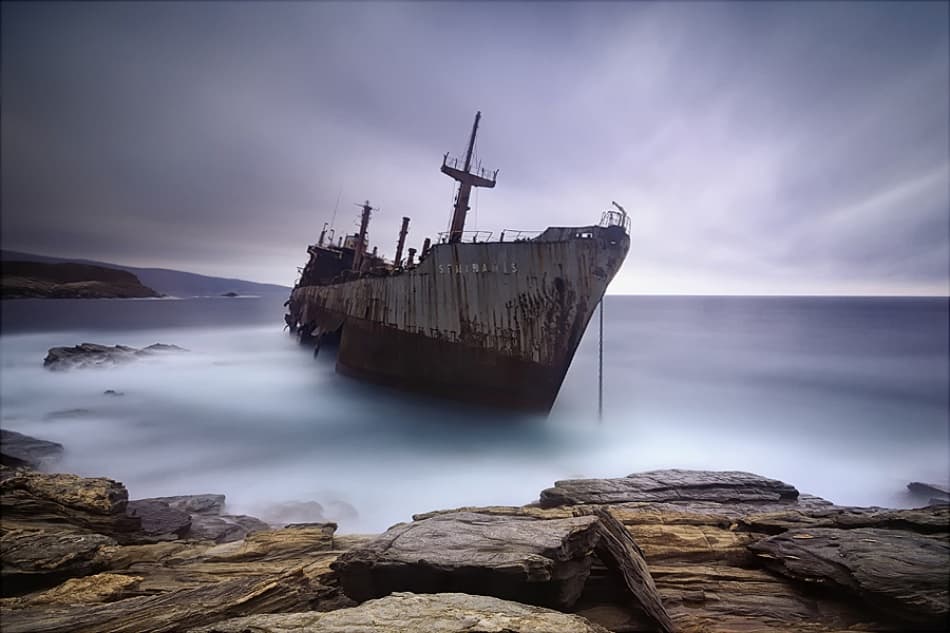 Moody Shipwreck Serenity by Maria Kaimaki — canvas wall art