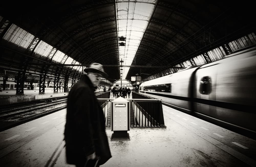 Man and Speeding Train by Mark Yugawa — canvas wall art