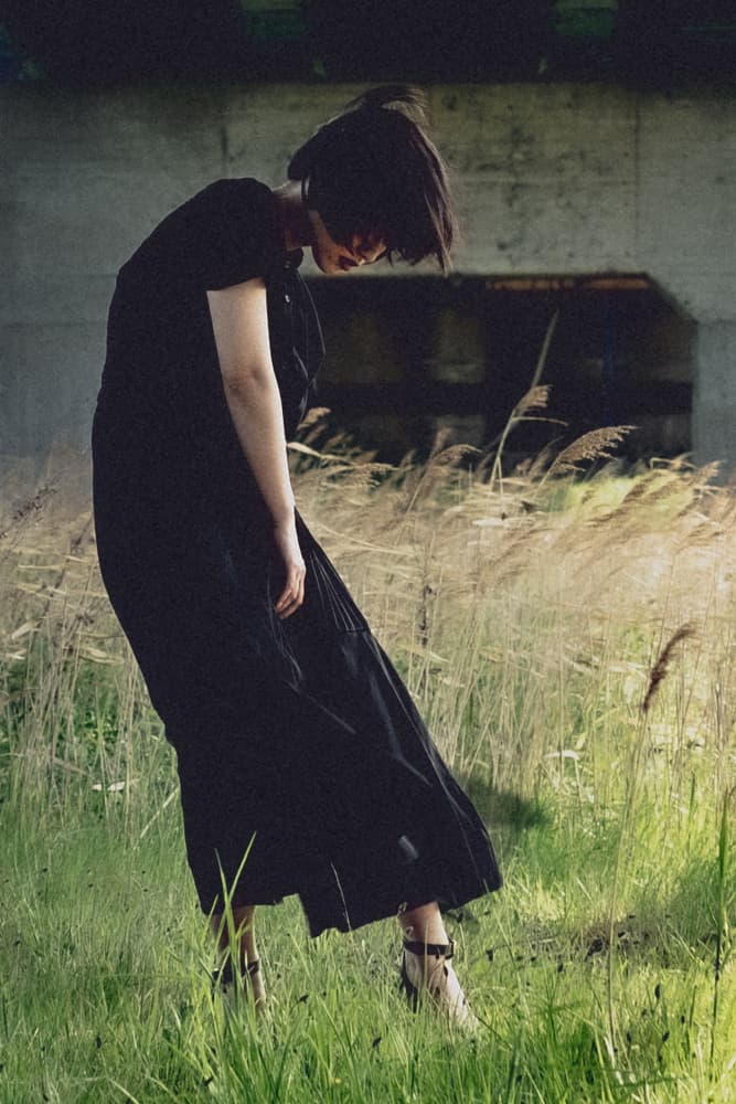 Pensive Woman In Grass by Kurosaki Sangan — canvas wall art