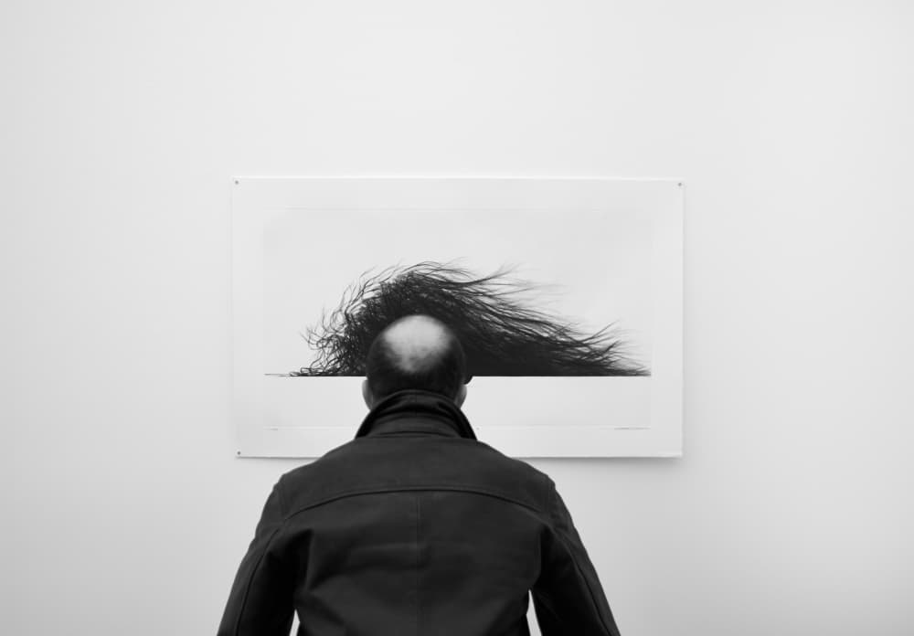 Man Viewing Abstract Art by Jorge Pena — canvas wall art